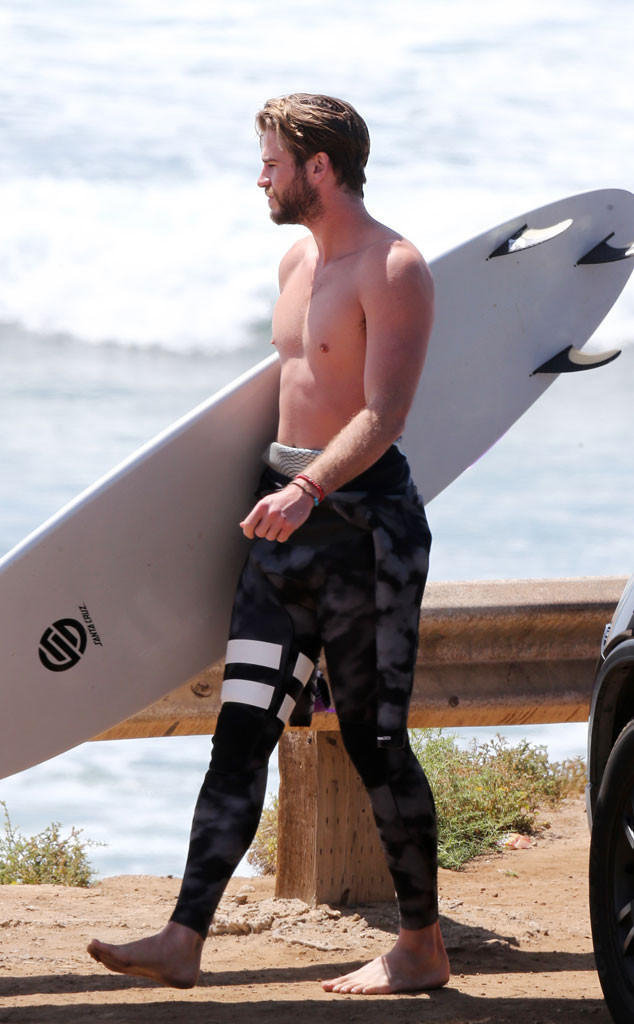 Liam Hemsworth Hits the Beach and Shows Off His Abs