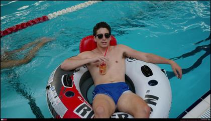 Milo Manheim relaxing in the swimming pool.