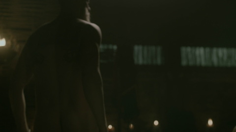 Alexander Ludwig Naked as Bjorn Lothbrok. Butt, Shirtless, beard, dimly lit. 123243