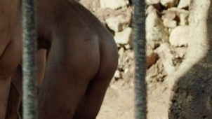 Rami Malek Nude as Louis Dega. Butt, bars on windows, bending forward. 87770