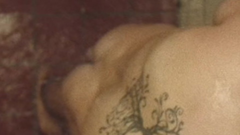 Jae Novak from Death House Naked. Butt, back tattoo, looking down. 92129
