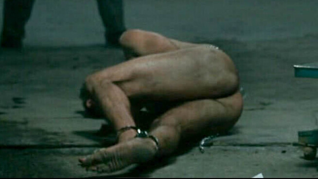Nudes of Anwar El-Ibrahimi from Rendition. Butt, barefoot, basement. 131748