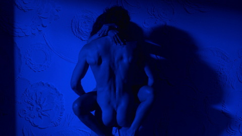 Adam Demos Nude as Brad Simon. Butt, Shirtless, Straight, against wall, blue lighting. 156884