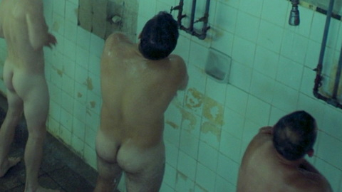 Nudes of Luis Garrido from Yosi, The Regretful Spy. Butt, barefoot, locker room showers. 174588