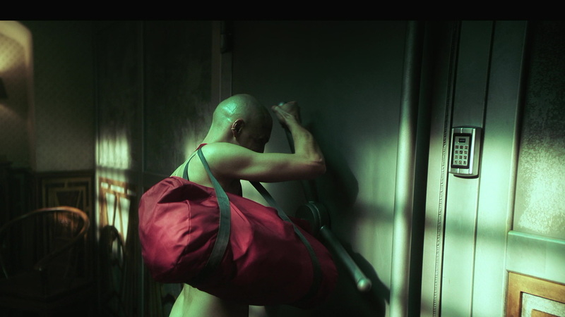 Szymon Wróblewski Naked as "Voltmeter". Butt, Shirtless, bald, red duffle bag. 184053