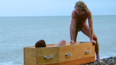 Frédéric from Lips of Blood Naked. Balls, Penis, Shirtless, beach, coffin. 198029