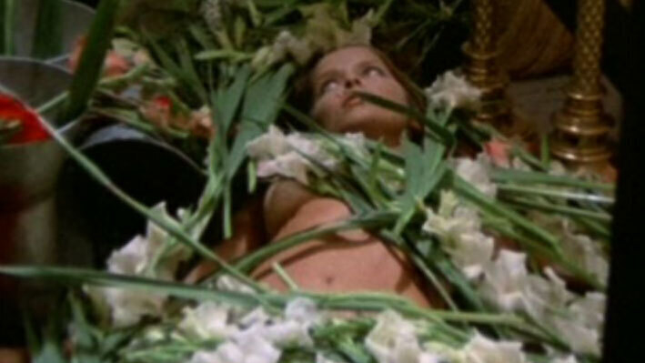 Sexiest Scenes of Mira from Short Night of  Glass Dolls. Sexy, covered with flowers. 585503