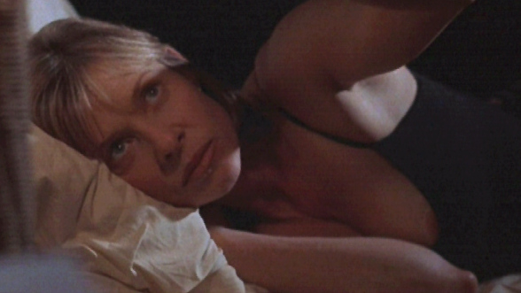 Kate Capshaw Nude in The Love Letter. Breasts, black top, laying in bed. 558814