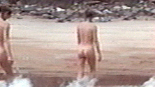 Nudes of Helen Cuffe from The Railway Station Man. Butt, back exposed, beach. 537924