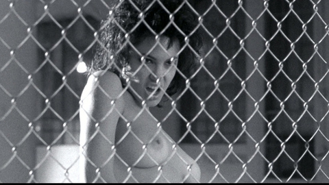 Angelina Jolie in Gia (1998) Breasts Behind Fence Black And White 701517