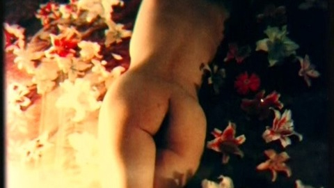 Courtney Love Nude in Cobain: Montage of Heck. Butt, blonde, flowers on ground. 763414
