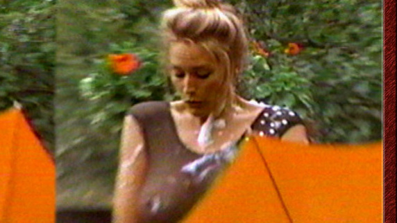 Sexiest Scenes of Herself from Sports Illustrated: Swimsuit 1993. Sexy, breasts through sheer top, orange umbrella. 543953