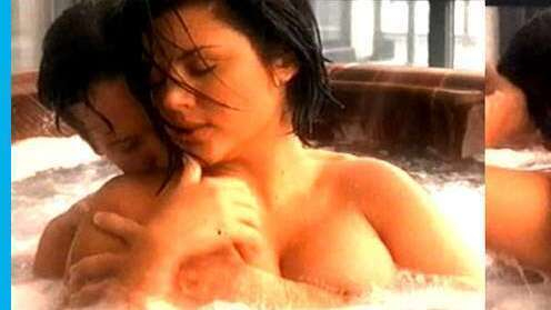 Buried Secrets's Sexiest Scenes with Tiffani-Amber Thiessen. Sexy, arm covering breasts, brunette. 553602