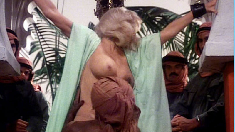 Dyanne Thorne Nude as Ilsa. Breasts, arms spread, big breasts. 553946