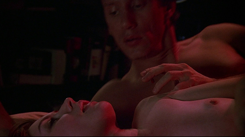 Deborah Harry Naked in Videodrome. Breasts, man holding needle, man/woman. 790417