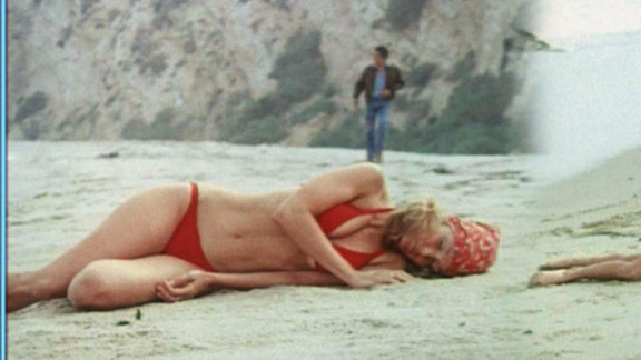 Sexiest Scenes of Angela de Vries from Hit Lady. Bikini, SFW, beach. 596639