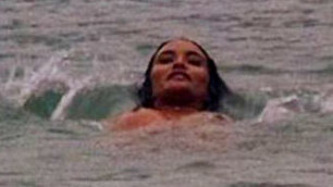Laura Gemser Naked in Reflections of Light. Breasts, black hair, floating on back. 583723