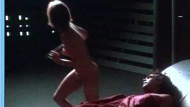 Lara Harris Nude in Circuit Breaker. Breasts, Butt, aiming gun, back exposed. 584710