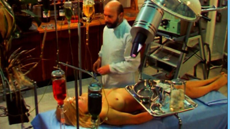 Julie Ege Nude in The Freakmaker. Breasts, exam table, laying down. 580918