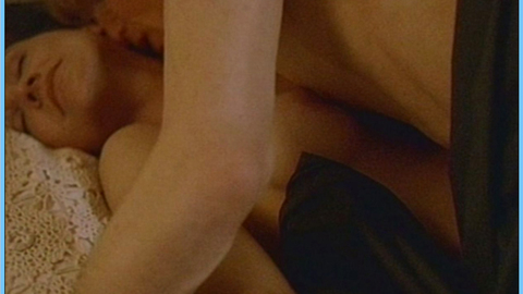Denice Duff Nude as Caroline / Victoria Thorn. Breasts, couple in bed, kissing neck. 607388
