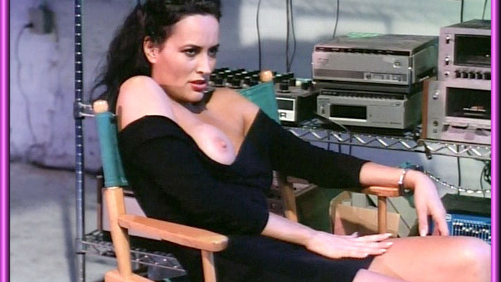 Erika Nann Nude in Die Watching. Breasts, dark hair, director's chair. 563464