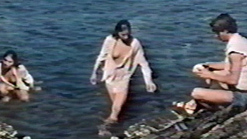 Nudes of Eléni from L' arbre sous la mer. Breasts, black hair, legs above water. 599550