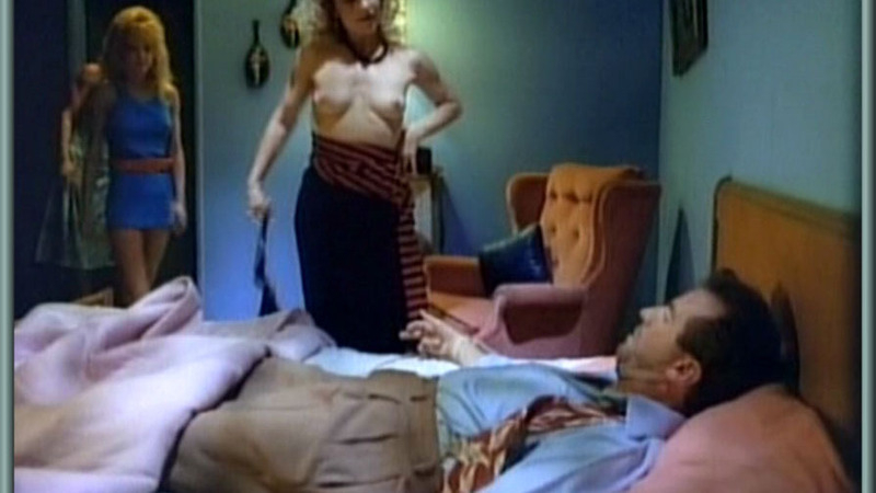 Tricia Burns Naked as Ilsa. Breasts, blonde, man sitting i nbed. 577515