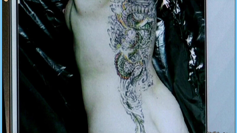 Christiane Scheda Nude in Tattoo. Breasts, Butt, back tattoo, black background. 602572