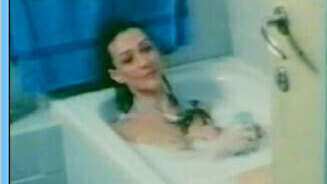 Cristina from Rings of Fear Naked. Breasts, black hair, lying in bath. 561191