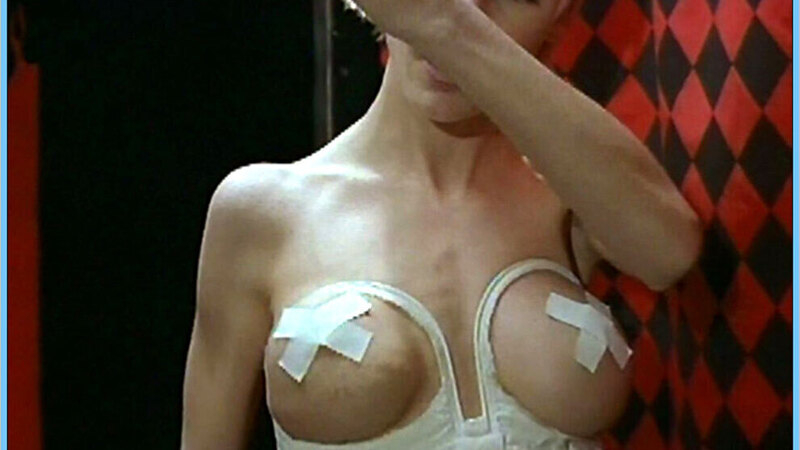 Sexiest Scenes of NA from Operation Midnight Climax. Sexy, fake breasts, nipples covered white top. 604019