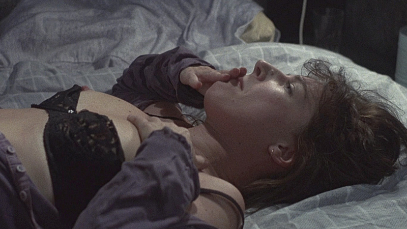 Deborah MacLaren Naked as Woman in Window. Breasts, black bra, lying down in bed. 700203