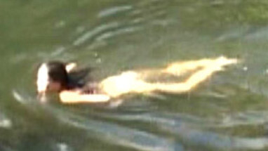 Megan McNally Naked as Olivia Noland. Butt, black hair, in water. 641859