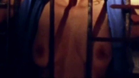 Simone Spoladore Nude in Magnifica 70. Breasts, behind bars, black tie. 768112