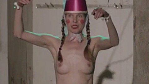 Die Zögerliche from The Truth of Lie Naked. Breasts, braided hair, dunce cap. 713255