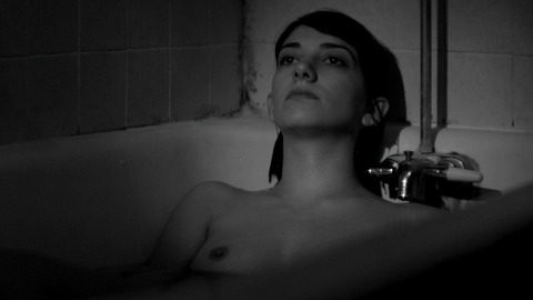Sheila Vand in A Girl Walks Home Alone at Night (2014) Breasts Bathtub Black And White 762366