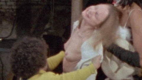 Illa Howe Nude as Girl on Guillotine. Breasts, Black, gray skirt. 749480
