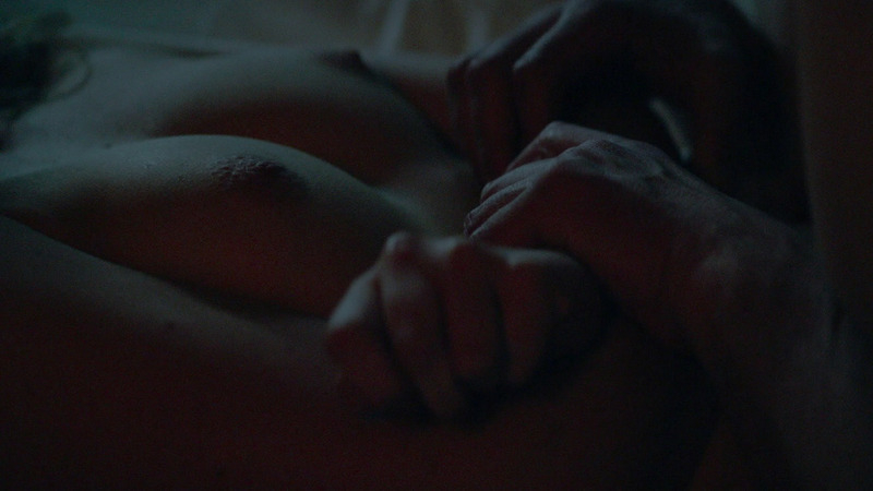 Nudes of Lola from Frank & Lola. Breasts, arms crossed, dark room. 806982