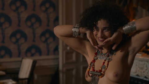 Nudes of Zohra Ben Brahim from Curiosa. Breasts, big necklace, hands under chin. 874398
