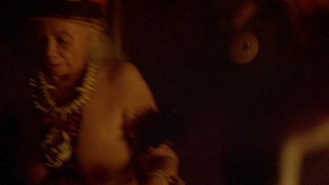 Nudes of Chanting Woman from The Relic. Breasts, bone necklace, fire. 957078
