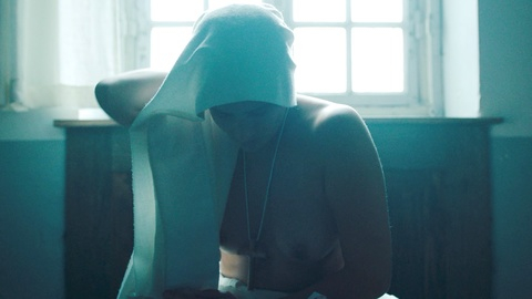 Julie De Bona Nude as Agnès. Breasts, cross necklace, in church. 983702