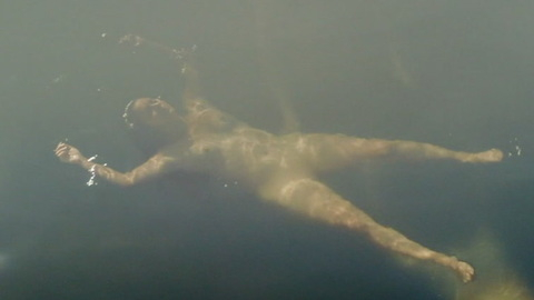stunt performer from Midday Black Midnight Blue Naked. Breasts, floating, floating in water. 989651